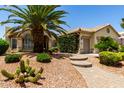 Charming single story with desert landscaping, featuring a walkway to the entryway at 3166 N 158Th Ave, Goodyear, AZ 85395