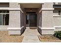 Front entrance with a security door and textured pillars, offering curb appeal at 5402 S 54Th Ln, Laveen, AZ 85339
