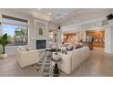 Bright living room featuring a fireplace, plush seating, and an open floor plan at 8540 E Mcdowell Rd # 119, Mesa, AZ 85207