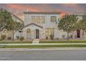 Inviting two-story home featuring a stucco facade, manicured landscaping and covered front porch entry at 10428 E Nopal Ave, Mesa, AZ 85209