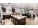 Spacious kitchen featuring a large island, ample counter space, stainless steel appliances, and an open layout at 1223 E Palo Verde Dr, Casa Grande, AZ 85122
