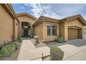 Inviting front entrance with well-maintained landscaping and decorative front door at 12448 N 129Th Pl, Scottsdale, AZ 85259