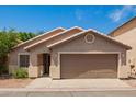 Charming single-story home with a well-maintained yard and a welcoming facade at 125 N 22Nd Pl # 53, Mesa, AZ 85213