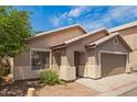Single-story home with desert landscaping, covered entryway, and an attached two-car garage at 125 N 22Nd Pl # 53, Mesa, AZ 85213