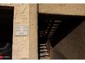 Entrance to apartment complex showcases unit numbers and outdoor stairway at 151 E Broadway Rd # 210, Tempe, AZ 85282