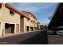 The exterior of the apartment complex shows multiple units and covered parking, providing convenient shelter at 151 E Broadway Rd # 210, Tempe, AZ 85282