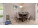 Cozy dining area with seating for four and lots of natural light at 17205 N 107Th Ave, Sun City, AZ 85373