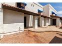 Charming townhome with a well-maintained exterior and inviting walkway to the front door at 2121 W Union Hills Dr # 113, Phoenix, AZ 85027