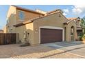 Two-story home with a two car garage, desert landscaping, and stucco exterior at 2324 W Melody Dr, Phoenix, AZ 85041