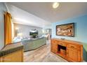 Inviting living room with wood floors, comfortable seating, and blue accent wall for a cozy retreat at 2524 S El Paradiso Dr # 82, Mesa, AZ 85202