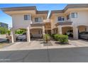 Inviting condo complex featuring covered parking, desert landscaping, and a charming facade at 3235 E Camelback Rd # 124, Phoenix, AZ 85018