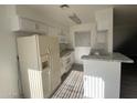 Beautiful kitchen features granite countertops, modern appliances, and a convenient breakfast bar for casual dining at 4820 N 89Th Ave # 88, Phoenix, AZ 85037
