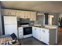 Efficient kitchen featuring bright cabinets, modern appliances, and ample counter space at 5735 E Mcdowell Rd # 63, Mesa, AZ 85215