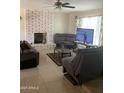 Open concept living room features a white brick fireplace and comfortable seating at 8307 W Indianola Ave, Phoenix, AZ 85037