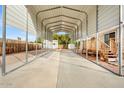View from within the home's large carport that leads to a small shed at 853 S Evangeline Ave, Mesa, AZ 85208