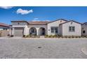 Charming single-story stucco home with a tile roof and an arched entryway at 11249 N Blakely St, Surprise, AZ 85388