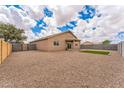 Spacious backyard featuring gravel, a covered patio, and well-maintained block wall fencing at 15120 S Amado Blvd, Arizona City, AZ 85123