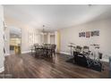 Spacious dining room with modern chandelier, wood floors, and plenty of natural light at 17606 N 2Nd Ave, Phoenix, AZ 85023