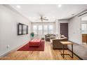 Bright living room featuring hardwood floors, neutral paint, and comfortable seating at 2062 S Emerson --, Mesa, AZ 85210