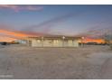 A spacious backyard featuring a covered patio, ideal for outdoor relaxation and entertaining at 28834 N 175Th Ave, Surprise, AZ 85387