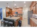 Modern kitchen featuring a large island, stainless steel appliances, and stylish pendant lighting at 3855 S Mcqueen Rd # 12, Chandler, AZ 85286