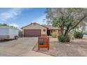 Inviting single-Gathering home featuring a private driveway and appealing desert landscaping at 4606 W Park Ave, Chandler, AZ 85226