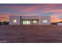 Modern home's rear exterior with large windows and doors, providing seamless indoor-outdoor living at 475 W Saddle Mountain Rd, Phoenix, AZ 85086