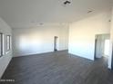 Spacious living room featuring modern flooring and lots of natural light at 5937 N Nigal Rd, Casa Grande, AZ 85194