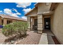 Inviting front porch with stone accents and a cozy seating area at 6638 W Nez Perce St, Phoenix, AZ 85043