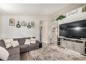 Spacious living room with a large sectional sofa and modern decor at 6638 W Nez Perce St, Phoenix, AZ 85043