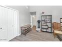 Bright bedroom with ample closet space and modern wood floors for a clean and organized space at 6915 E Lakeview Ave, Mesa, AZ 85209