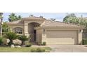 Charming home featuring a two-car garage, gated entrance, and well-maintained landscaping enhancing curb appeal at 10175 E Cochise Dr, Scottsdale, AZ 85258