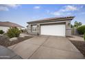 Attached two-car garage with a spacious driveway, perfect for parking and easy access at 15064 N 54Th Way, Scottsdale, AZ 85254