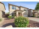 Charming two-story home featuring a lush garden and a well-manicured landscape at 1821 E Patrick Ln, Phoenix, AZ 85024