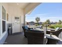 Relaxing covered porch with wicker furniture, ideal for outdoor seating and enjoying neighborhood views at 2206 S Ellsworth Rd # 160B, Mesa, AZ 85209