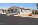 Well-maintained single-Gathering home featuring a 9th Street sign, showcasing the property's location at 2206 S Ellsworth Rd # 160B, Mesa, AZ 85209