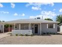 Charming single-story home with a well-maintained front yard and covered entry at 2223 E Roma Ave, Phoenix, AZ 85016