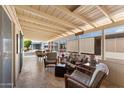 Enclosed patio featuring comfortable seating and tile flooring for relaxing or entertaining at 5735 E Mcdowell Rd # 388, Mesa, AZ 85215