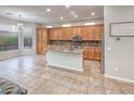 Spacious kitchen with granite countertops, stainless steel appliances, and ample cabinet space at 7252 E Nance St, Mesa, AZ 85207