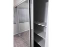 Bedroom closet with mirrored sliding doors and shelving at 8055 E Thomas Rd # H103, Scottsdale, AZ 85251