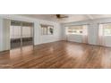Spacious living room with sleek laminate flooring and abundant natural light at 8302 E Dutchman Dr, Mesa, AZ 85208