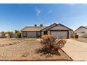 Well-kept single-level home with desert landscaping, easy to care for at 8703 W Golden Ln, Peoria, AZ 85345