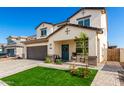 Beautiful two-story home with a manicured lawn and covered front porch at 1297 W Chillingham W Rd, San Tan Valley, AZ 85143