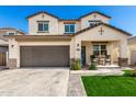 Inviting two-story home boasts a spacious garage and covered front porch at 1297 W Chillingham W Rd, San Tan Valley, AZ 85143