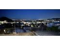 Expansive city views at night from this property overlooking the neighborhood and mountains in the distance at 13013 N 18Th St, Phoenix, AZ 85022