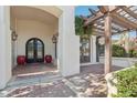 Arched entrance way featuring decorative columns, brick flooring, and a wooden pergola at 1330 N 40Th St # 1, Mesa, AZ 85205