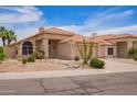 Inviting single-story home featuring desert landscaping, complemented by a tile roof and neutral exterior at 15827 S 12Th Pl, Phoenix, AZ 85048