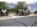 Charming single-story home featuring a two-car garage and mature landscaping in a suburban neighborhood at 1742 E Chaparral Dr, Casa Grande, AZ 85122