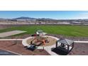 Community playground features modern equipment and a shaded picnic area, perfect for families at 17479 W Victory St, Goodyear, AZ 85338