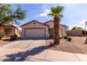 Charming single story home with a two car garage, desert landscaping, and a cozy front porch at 2635 W Atlanta Ave, Phoenix, AZ 85041
